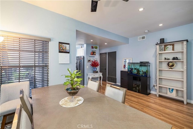 dining area with baseboards, visible vents, a ceiling fan, light wood-style floors, and recessed lighting