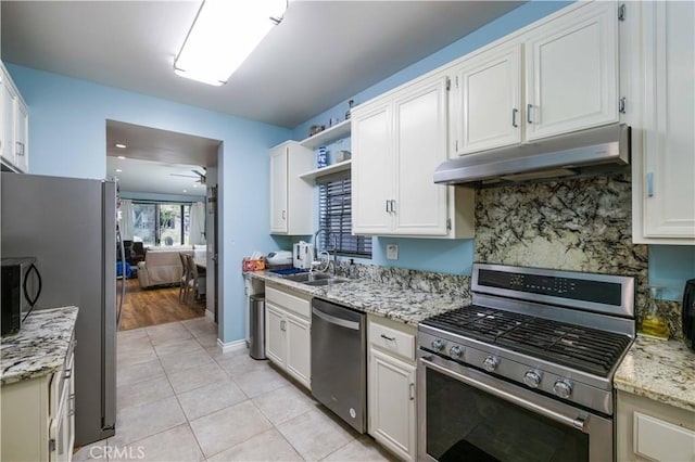 kitchen with light tile patterned floors, under cabinet range hood, stainless steel appliances, a sink, and open shelves