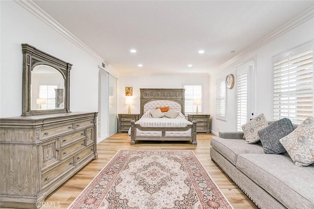 bedroom featuring light wood-type flooring, ornamental molding, and recessed lighting