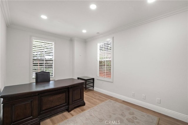 office featuring light wood-type flooring, healthy amount of natural light, baseboards, recessed lighting, and ornamental molding