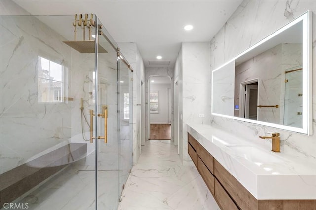 full bathroom with a marble finish shower, vanity, recessed lighting, and marble finish flooring