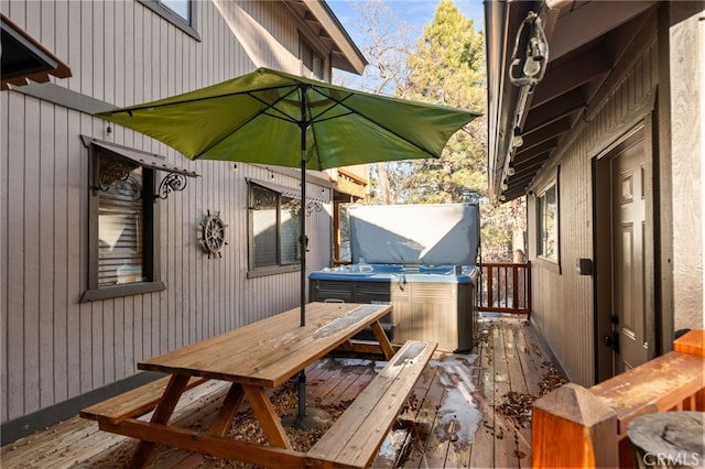 wooden terrace with a hot tub