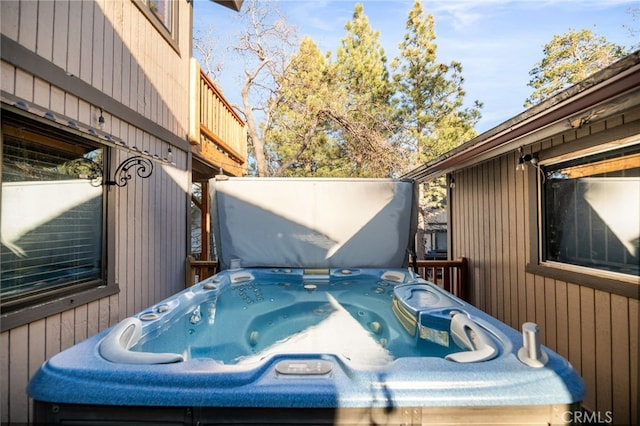 exterior space with a hot tub