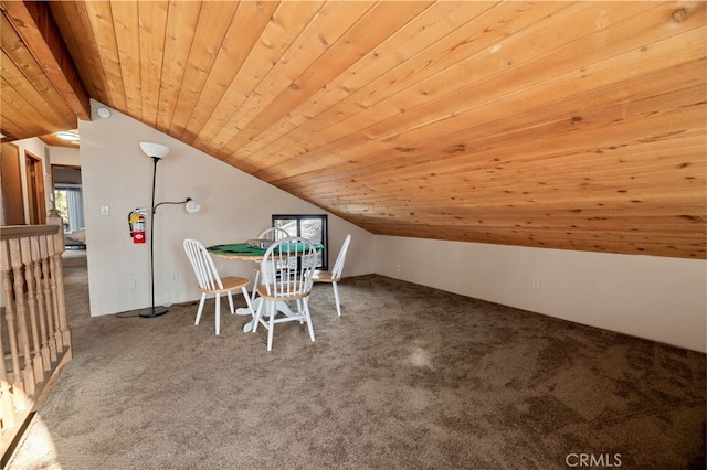 unfurnished dining area with lofted ceiling, carpet flooring, and wood ceiling