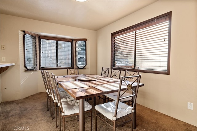 view of carpeted dining area