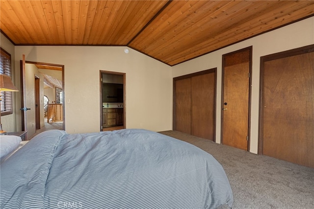 bedroom featuring lofted ceiling, wooden ceiling, carpet flooring, and two closets