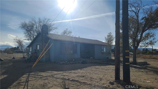 view of front of property featuring a chimney