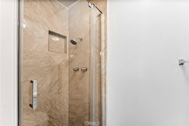 full bathroom featuring a shower stall