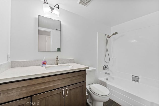 full bathroom featuring toilet,  shower combination, vanity, and visible vents