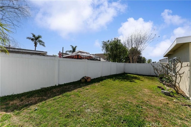 view of yard featuring a fenced backyard