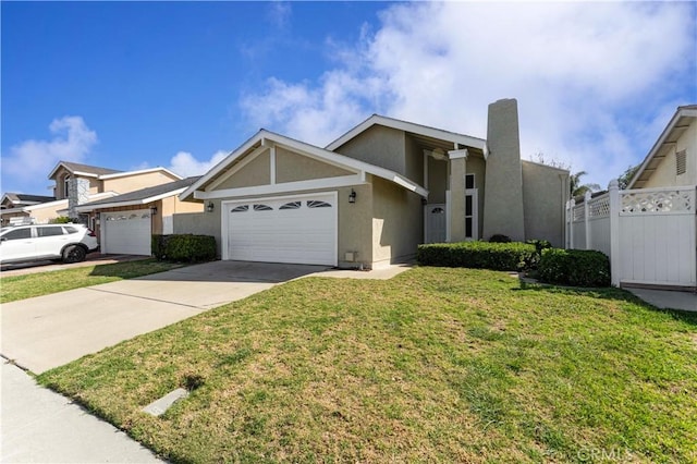 view of front facade featuring a garage, driveway, fence, a front yard, and stucco siding