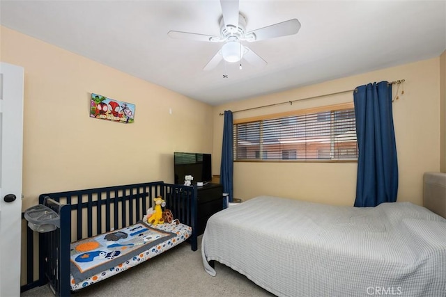 carpeted bedroom featuring ceiling fan