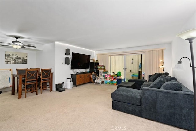 living area featuring ceiling fan and light carpet