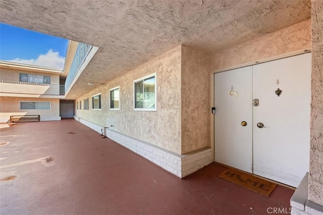 doorway to property with stucco siding