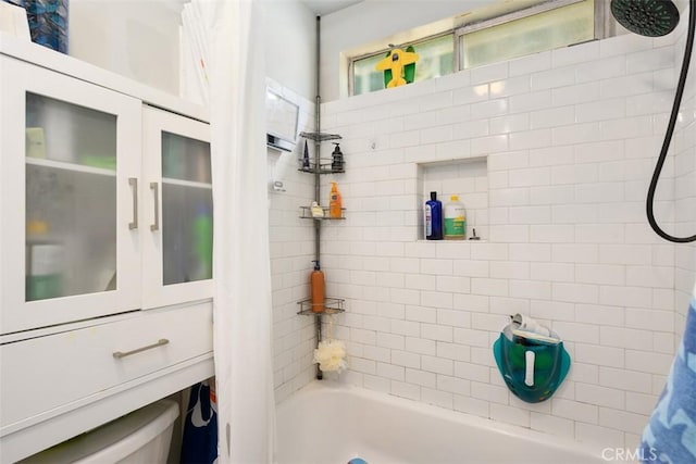 full bath featuring shower / tub combo with curtain