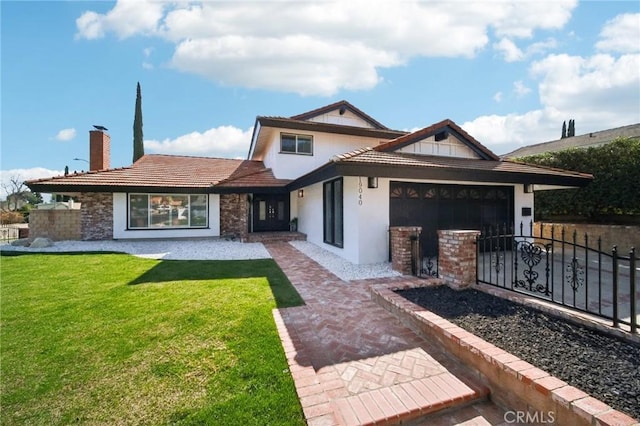 exterior space featuring a garage, fence, a lawn, stucco siding, and a chimney