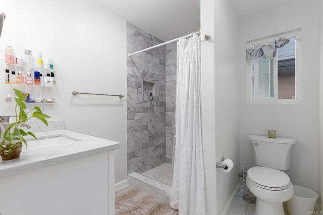 full bath featuring tile patterned flooring, toilet, vanity, baseboards, and tiled shower