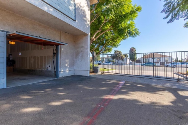 view of gate with a residential view and fence