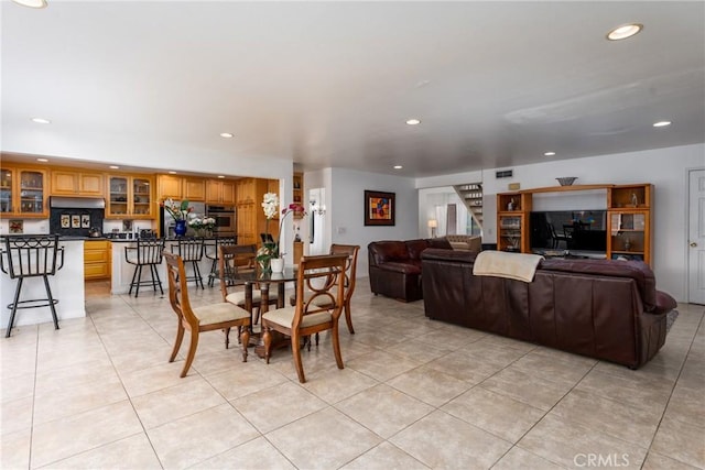 dining area featuring recessed lighting and light tile patterned floors