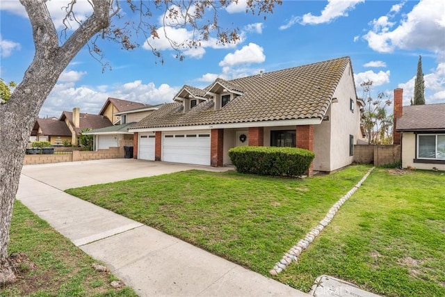 view of front of house featuring driveway, a front yard, fence, and a tiled roof