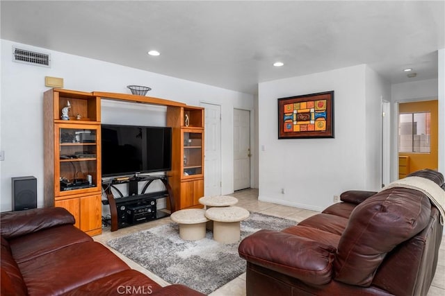 living area with baseboards, light tile patterned floors, visible vents, and recessed lighting