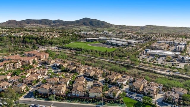 birds eye view of property with a mountain view and a residential view