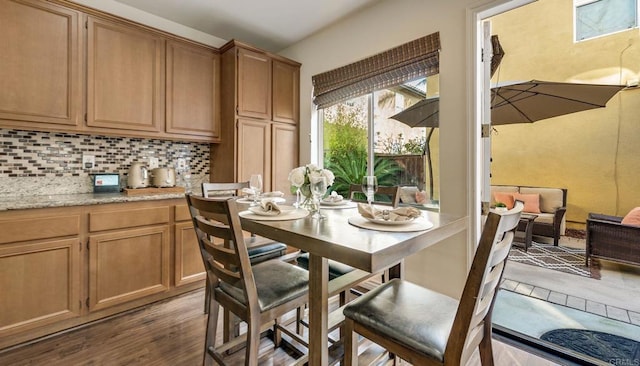 dining space with dark wood-type flooring