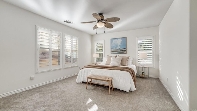 bedroom featuring baseboards, visible vents, carpet floors, and ceiling fan