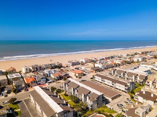 aerial view featuring a water view and a beach view