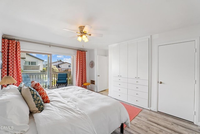 bedroom featuring a ceiling fan, light wood-style flooring, and access to exterior