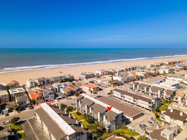 bird's eye view featuring a water view and a view of the beach