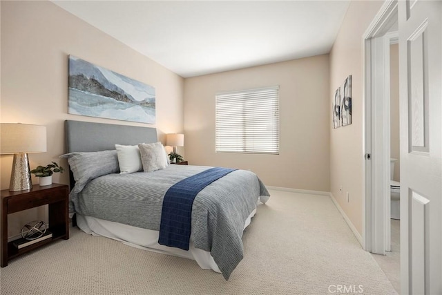 carpeted bedroom with baseboards