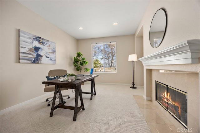 office area featuring carpet flooring, a fireplace, and baseboards