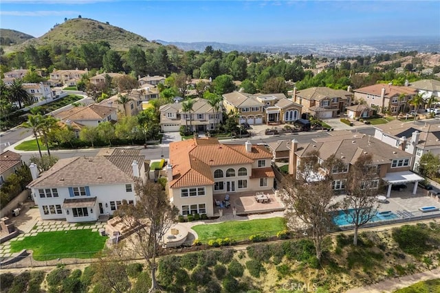 drone / aerial view with a mountain view and a residential view