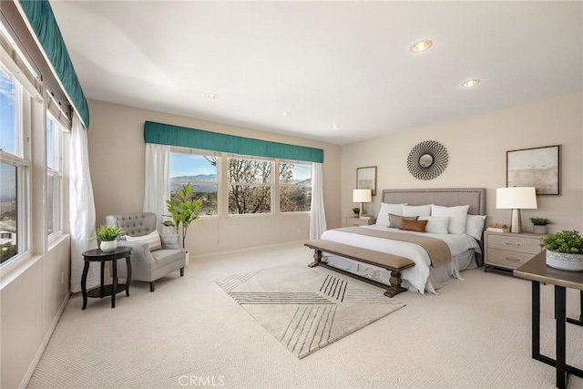 carpeted bedroom with recessed lighting