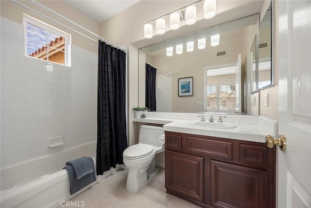 bathroom featuring visible vents, toilet, shower / bath combo with shower curtain, vanity, and tile patterned floors