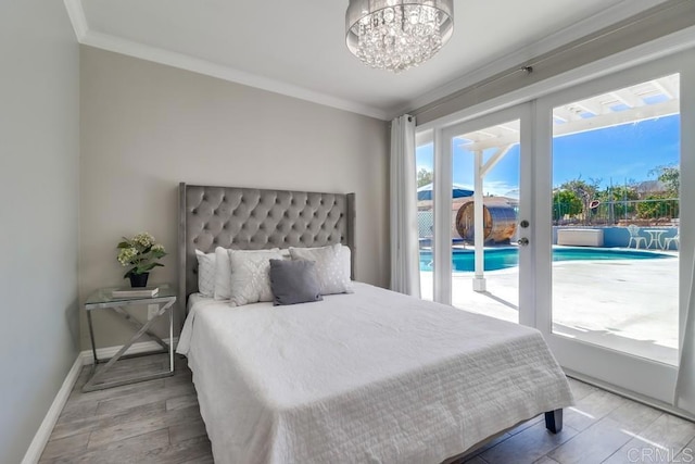 bedroom featuring access to exterior, french doors, crown molding, wood finished floors, and baseboards