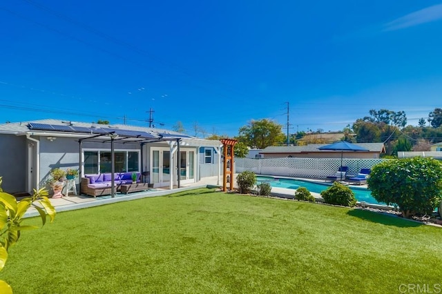 rear view of property with a fenced in pool, a lawn, a pergola, a fenced backyard, and an outdoor living space