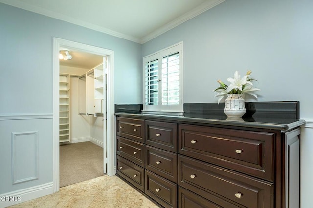 walk in closet featuring light carpet