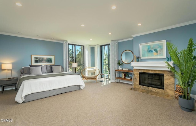 bedroom featuring floor to ceiling windows, ornamental molding, carpet flooring, recessed lighting, and a fireplace