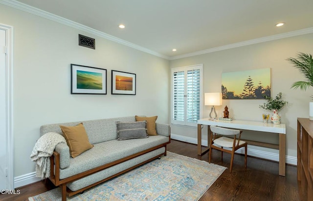 living area featuring ornamental molding, baseboards, and wood finished floors