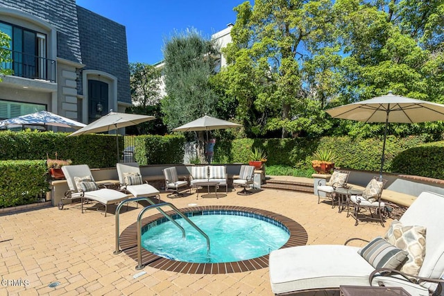 view of pool featuring fence and a patio area