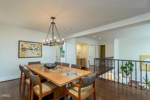 dining area with crown molding, wood finished floors, and baseboards