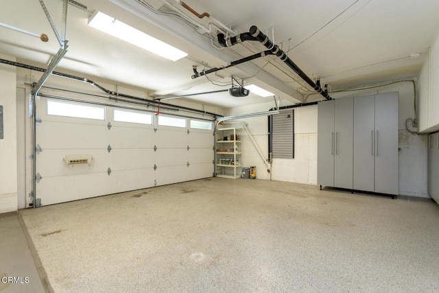 garage with electric panel and a garage door opener