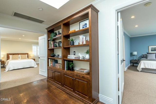 bedroom featuring visible vents, dark wood-style floors, recessed lighting, crown molding, and baseboards