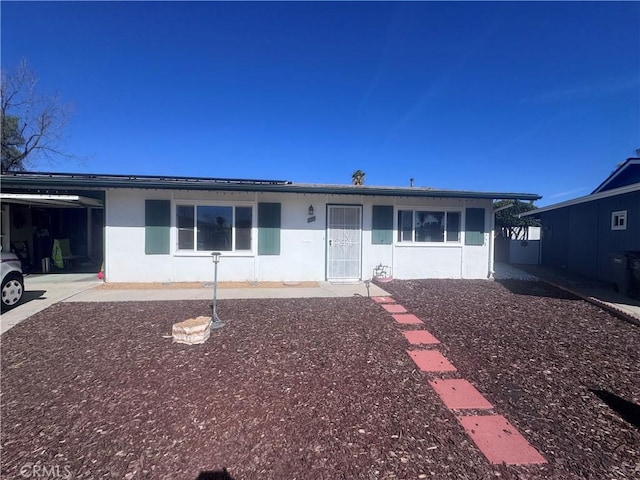 single story home featuring stucco siding