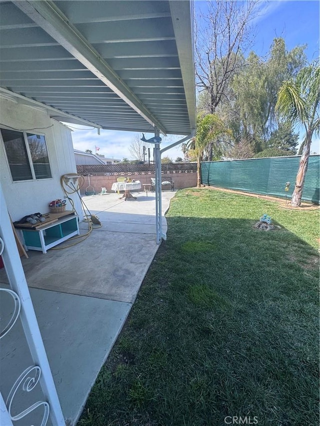 view of yard featuring a patio and a fenced backyard