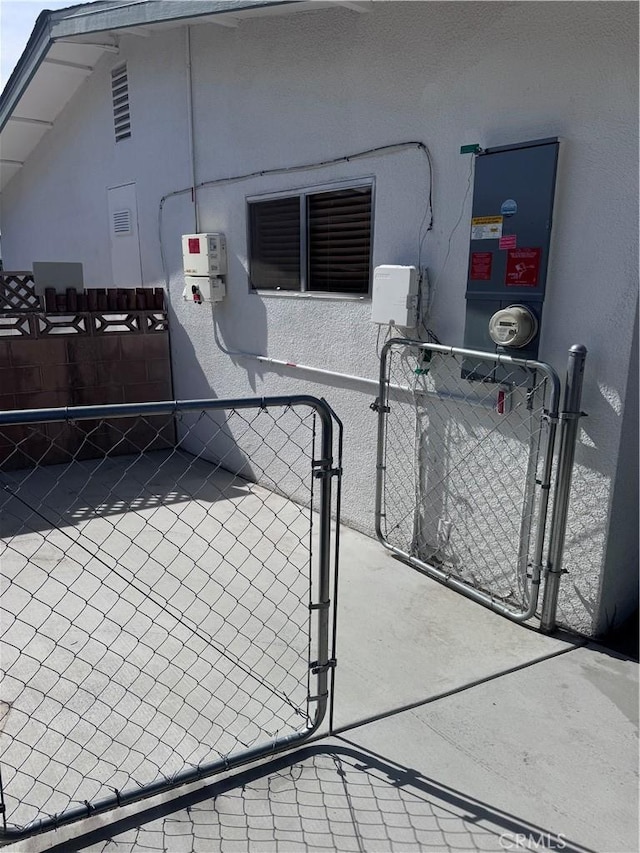view of gate with fence
