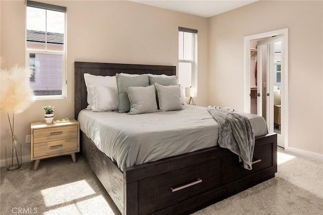 carpeted bedroom with baseboards