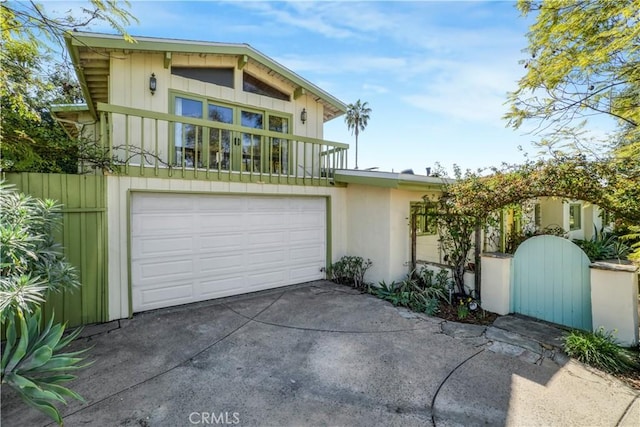 view of front of home featuring a garage and concrete driveway